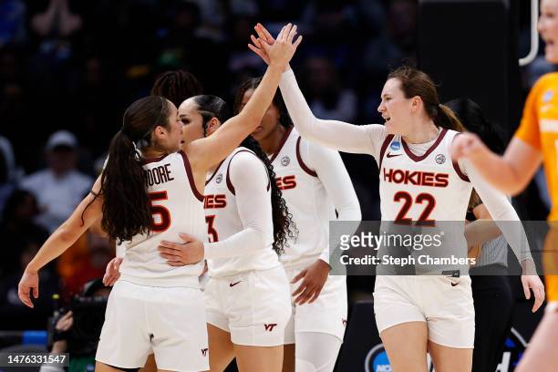 Georgia Amoore of the Virginia Tech Hokies celebrates with Cayla King during the second quarter against the Tennessee Lady Vols in the Sweet 16 round...