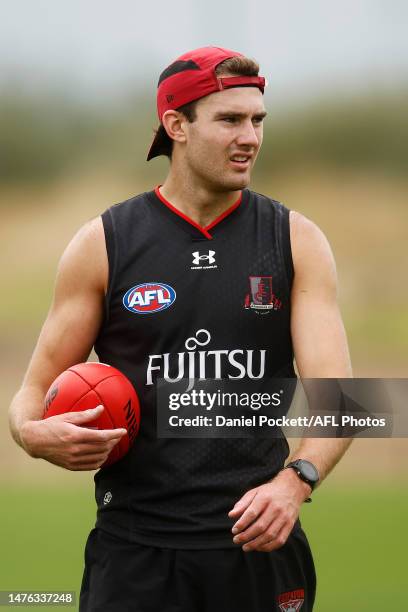 Zach Reid of the AFL Essendon Bombers trains on the other field during the round one VFLW match between the Essendon Bombers and Box Hill Hawks at...