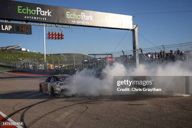 Allmendinger, driver of the Celsius Chevrolet, celebrates with a burnout after winning the NASCAR Xfinity Series Pit Boss 250 at Circuit of The...