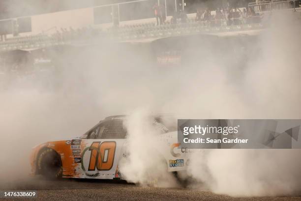 Allmendinger, driver of the Celsius Chevrolet, celebrates with a burnout after winning the NASCAR Xfinity Series Pit Boss 250 at Circuit of The...