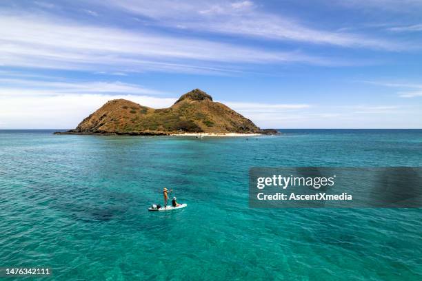 paddleboarding on a oahu vacation - lanikai beach stock pictures, royalty-free photos & images