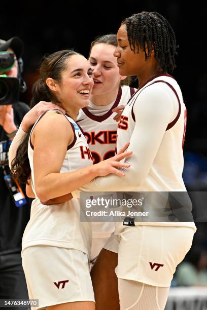 Georgia Amoore of the Virginia Tech Hokies celebrates with teammates after defeating the Tennessee Lady Vols 73-64 in the Sweet 16 round of the NCAA...