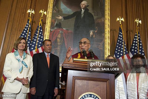 Tibetan spiritual leader the Dalai Lama speaks alongside US Speaker of the House John Boehner , House Minority Leader Nancy Pelosi , Representative...