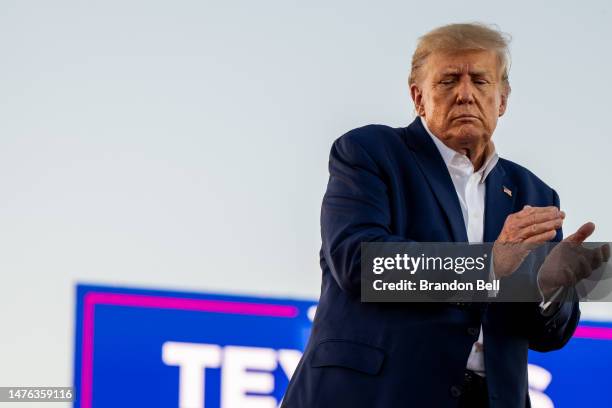 Former U.S. President Donald Trump applauds at the conclusion of a rally at the Waco Regional Airport on March 25, 2023 in Waco, Texas. Former U.S....