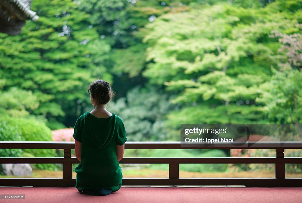 Woman sitting at garden