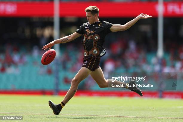 Fergus Greene of the Hawks warms up during the round two AFL match between Sydney Swans and Hawthorn Hawks at Sydney Cricket Ground, on March 26 in...