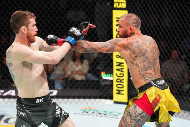 Marlon Vera of Ecuador punches Cory Sandhagen in a bantamweight fight during the UFC Fight Night event at AT&T Center on March 25, 2023 in San...