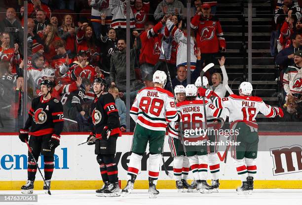 Ondrej Palat, Kevin Bahl, Dougie Hamilton, Jack Hughes, and Nico Hischier of the New Jersey Devils celebrate a goal scored by Hamilton during the...