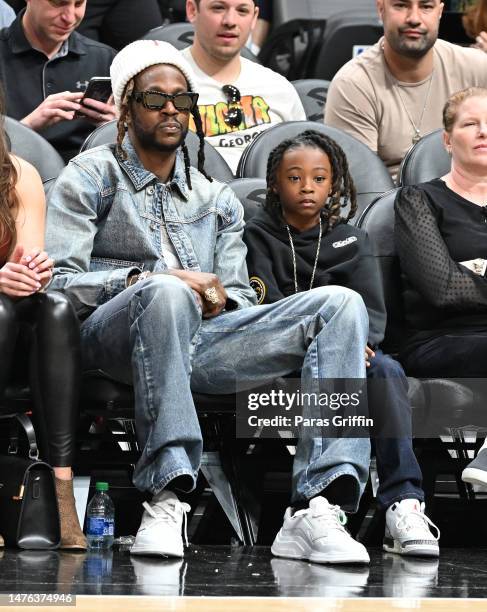 Rapper 2 Chainz and Halo Epps attend the game between the Indiana Pacers and the Atlanta Hawks at State Farm Arena on March 25, 2023 in Atlanta,...