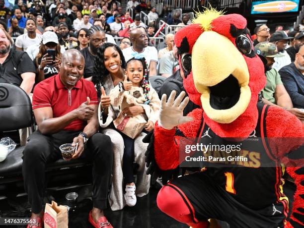 Simon Guobadia, Porsha Williams, Pilar McKinley and Harry the Hawk attend the game between the Indiana Pacers and the Atlanta Hawks at State Farm...