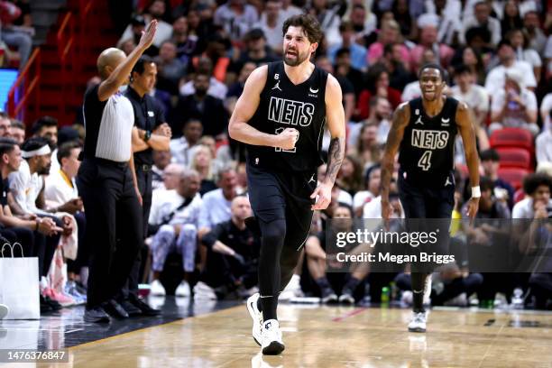 Joe Harris of the Brooklyn Nets reacts during the fourth quarter of the game against the Miami Heat at Miami-Dade Arena on March 25, 2023 in Miami,...