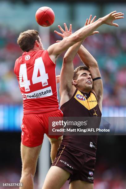 Finn Maginness of the Hawks is challenged by Jake Lloyd of the Swans during the round two AFL match between Sydney Swans and Hawthorn Hawks at Sydney...