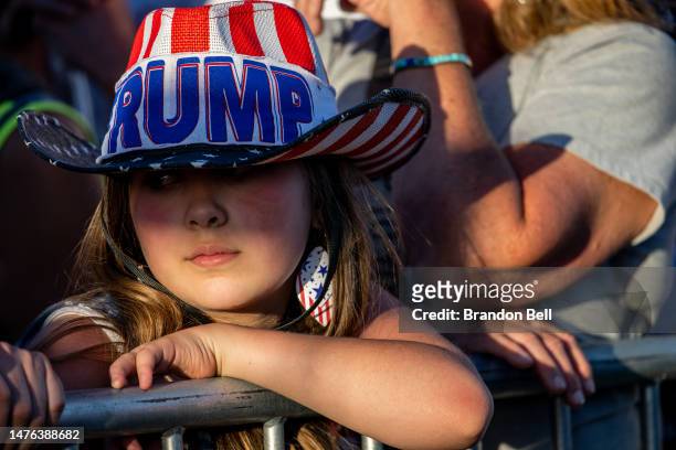 Child looks on as former U.S. President Donald Trump speaks during a rally at the Waco Regional Airport on March 25, 2023 in Waco, Texas. Former U.S....