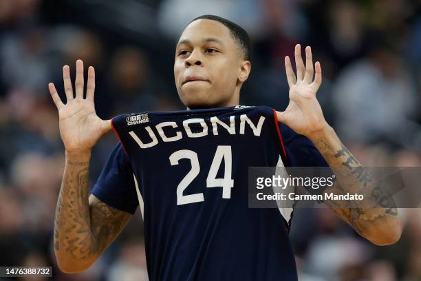 Jordan Hawkins of the Connecticut Huskies celebrates after making a three point basket during the second half against the Gonzaga Bulldogs in the...