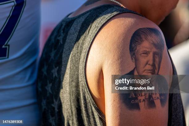 Former U.S. President Donald Trump's portrait is seen tattooed on a persons arm during a rally at the Waco Regional Airport on March 25, 2023 in...