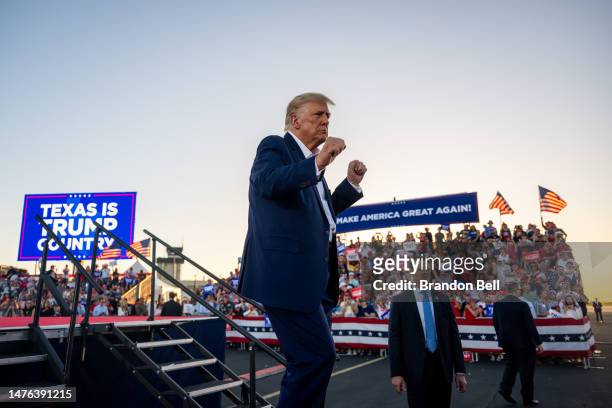 Former U.S. President Donald Trump dances while exiting after speaking during a rally at the Waco Regional Airport on March 25, 2023 in Waco, Texas....