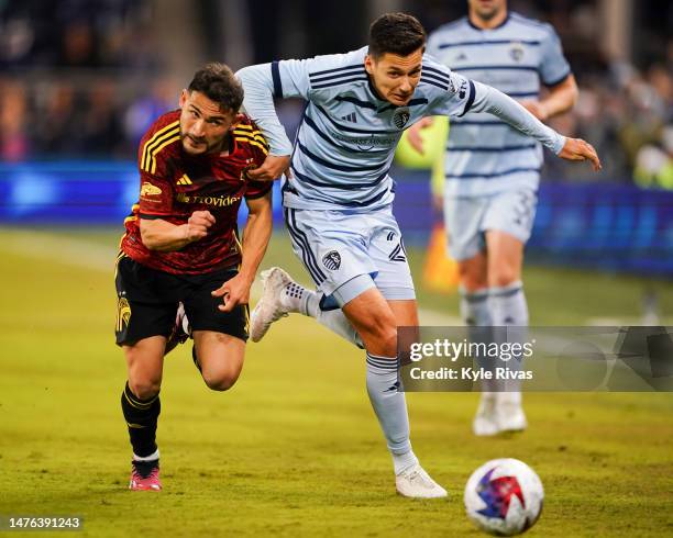 Daniel Sallói of Sporting Kansas City and Cristian Roldan of the Seattle Sounders battle for possession during the second half at Children's Mercy...