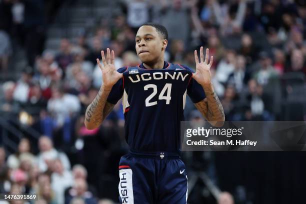 Jordan Hawkins of the Connecticut Huskies celebrates after making a three point basket during the second half against the Gonzaga Bulldogs in the...