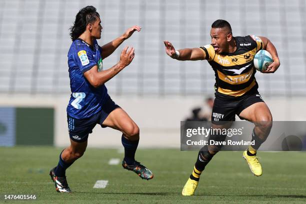 Toni Pulu of the Force is challenged by Zarn Sullivan of the Blues during the round five Super Rugby Pacific match between Blues and Western Force at...