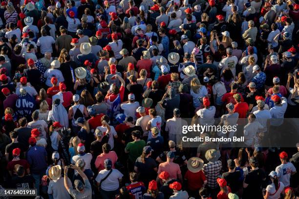 Supporters listen as former U.S. President Donald Trump speaks at the Waco Regional Airport on March 25, 2023 in Waco, Texas. Former U.S. President...