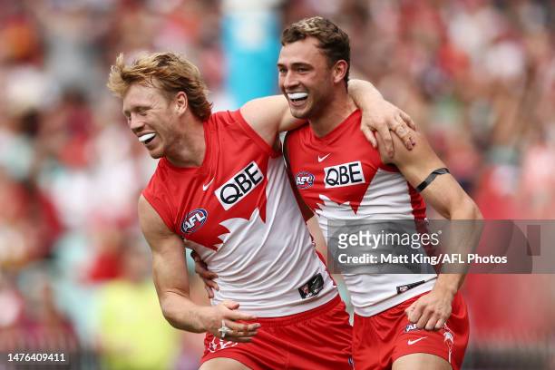 Callum Mills of the Swans celebrates with Will Hayward of the Swans after kicking a goal during the round two AFL match between Sydney Swans and...