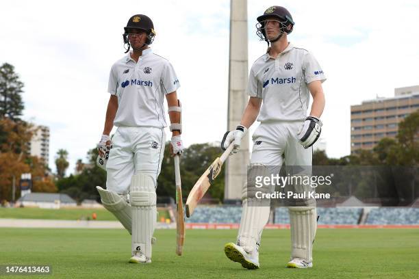 Teague Wyllie and Cameron Bancroft of Western Australia walk from the field at the lunch break during the Sheffield Shield Final match between...