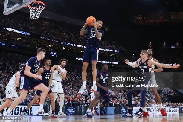 Jordan Hawkins of the Connecticut Huskies rebounds a ball during the second half against the Gonzaga Bulldogs in the Elite Eight round of the NCAA...