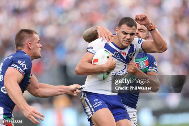 Jacob Kiraz of the Bulldogs is tackled by Dylan Walker and Jackson Ford of the Warriors during the round four NRL match between New Zealand Warriors...