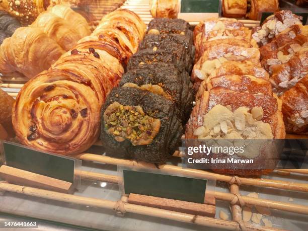 pastry display in a bakery - pain au chocolat stock pictures, royalty-free photos & images