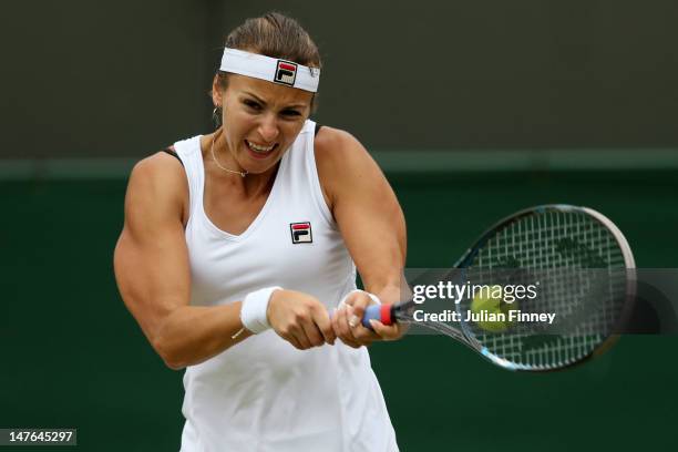 Yaroslava Shvedova of Kazakhstan hits a backhand return during her Ladies' singles fourth round match against Serena Williams of USA on day seven of...