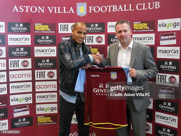 New signing Karim El Ahmadi and Aston Villa Manager Paul Lambert pose with an Aston Villa shirt at the Bodymoor Heath Trainng ground on July 2,2012...