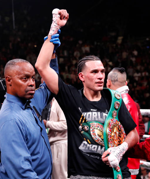 David Benavidez poses with referee Kenny Bayless after defeating Caleb Plant in a WBC super middleweight fight at MGM Grand Garden Arena on March 25,...