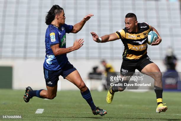 Toni Pulu of the Force is challenged by Zarn Sullivan of the Blues during the round five Super Rugby Pacific match between Blues and Western Force at...