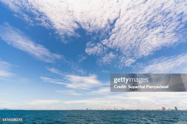 moving cloud and coast and high building - altocumulus stock pictures, royalty-free photos & images