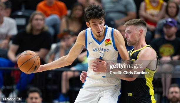 Chet Holmgren of the Oklahoma City Thunder backs down Micah Potter of the Utah Jazz during the first half of their NBA Summer League game July 3,...