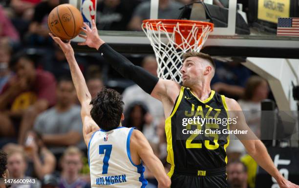 Chet Holmgren of the Oklahoma City Thunder has a shot blocked by Micah Potter of the Utah Jazz during the first half of their NBA Summer League game...