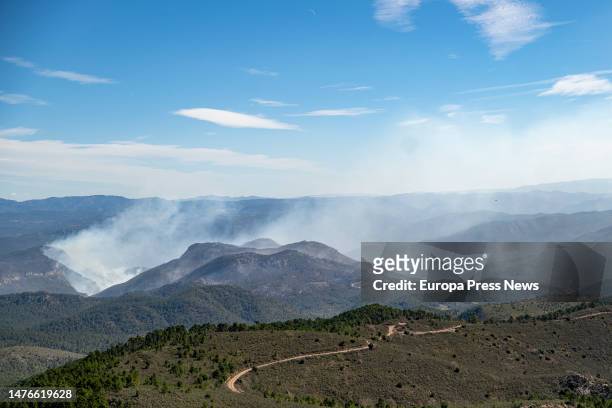 Smoke columns in the Maigmona ravine, where the most dangerous focus of the forest fire is now, on 26 March, 2023 in Castellon, Community of...