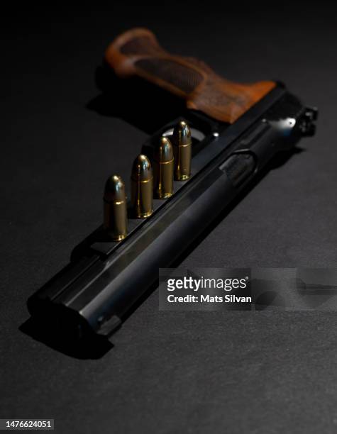 elegant semiautomatic 9mm handgun and bullet ammunition - 9mm pistol stock-fotos und bilder