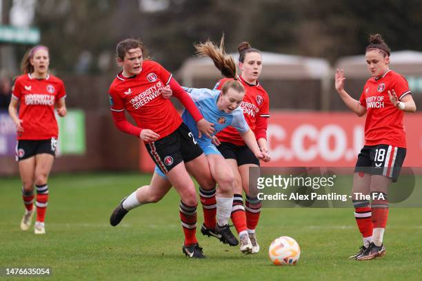 Jessica Brown of Sunderland is tackled by Corinne Henson and Lauren Bruton of Charlton Athletic during the Barclays FA Women's Championship match...