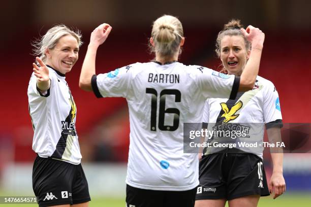 Kirsty Barton of Lewes celebrates with teammates Amber-Keegan Stobbs and Paula Howells of Lewes after scoring the team's first goal during the...