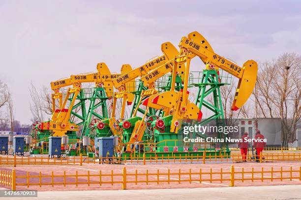 Oil derricks operate at Daqing Oilfield on March 26, 2023 in Daqing, Heilongjiang Province of China.