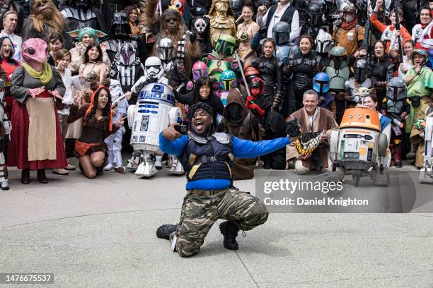 Cosplayer/photographer Brandon Jackson takes a selfie with a large group of Star Wars cosplayers at Day 2 of WonderCon 2023 at Anaheim Convention...