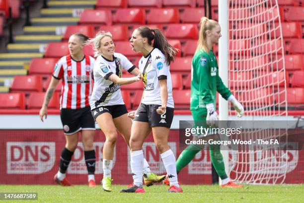 Ellie Mason of Lewes celebrates with teammate Paula Howells after scoring the team's third goal during the Barclays FA Women's Championship match...