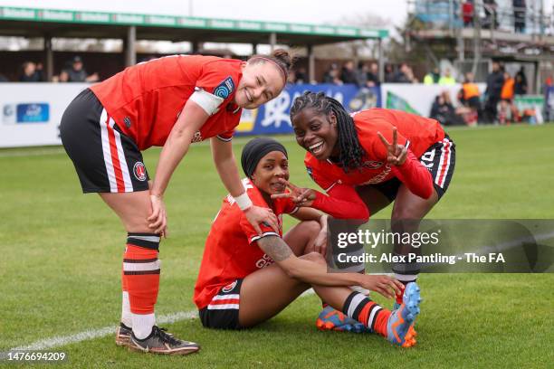 Melissa Johnson of Charlton Athletic celebrates with teammates Lois Roche and Freda Ayisi after scoring the team's second goal during the Barclays FA...