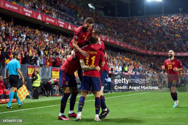Joselu of Spain celebrates with teammates after scoring the team's third goal during the UEFA EURO 2024 qualifying round group A match between Spain...