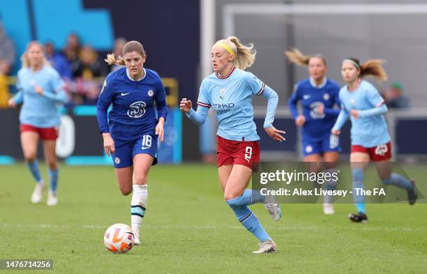 Chloe Kelly of Manchester City dribbles with the ball past Maren Mjelde of Chelsea during the FA Women's Super League match between Manchester City...