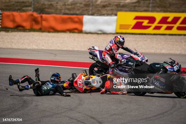 Marc Marquez of Spain and Repsol Honda Team crashed with local hero Miguel Oliveira of Portugal and CryptoDATA RNF MotoGP Team during the race of the...