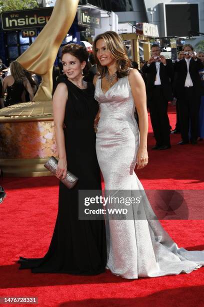 Tina Fey and Mariska Hargitay attend the 61st Primetime Emmy Awards at the NOKIA Theatre. Fey wears a Gucci gown, with a VBH clutch and art deco...