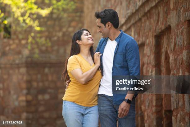 couple spending leisure time at ancient travel destination - indian wife stock pictures, royalty-free photos & images