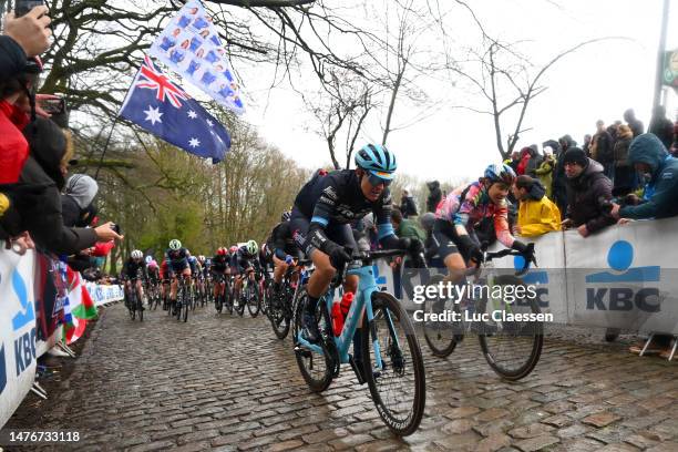 Lucinda Brand of The Netherlands and Team Trek – Segafredo and Elise Chabbey of Switzerland and Team Canyon//SRAM Racing compete passing through a...